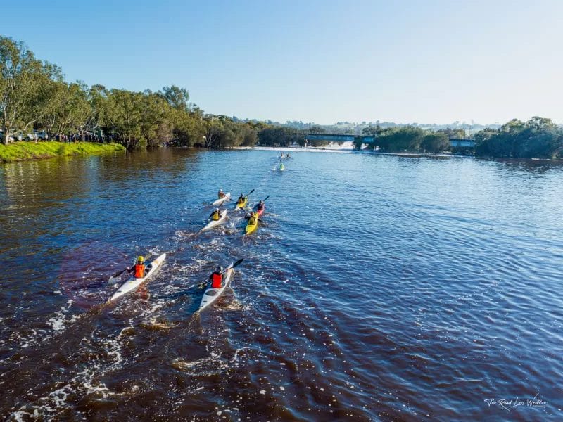 Kayakers going down the swan river for the Avon Descent